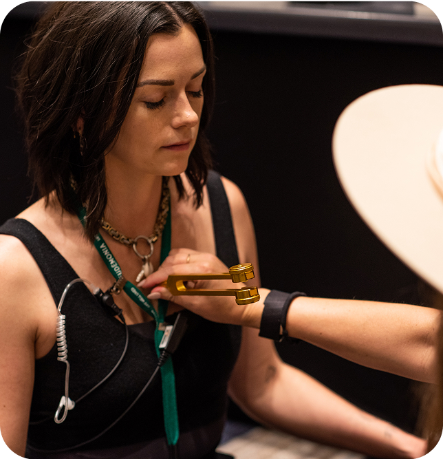Attendee receiving sound healing at Eudēmonia Summit 2024