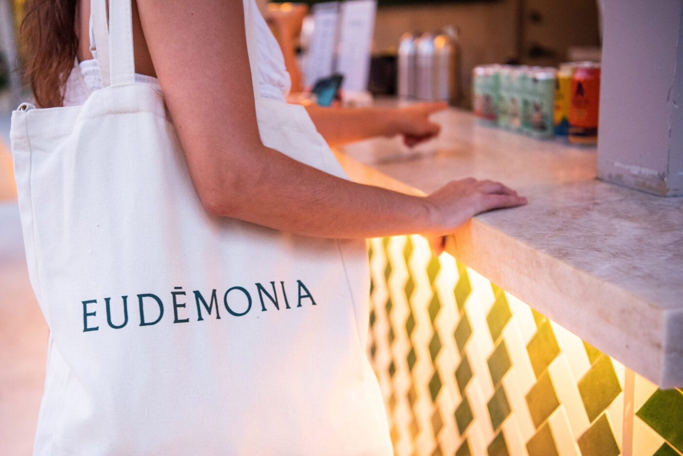 Eudemonia attendee at booth.