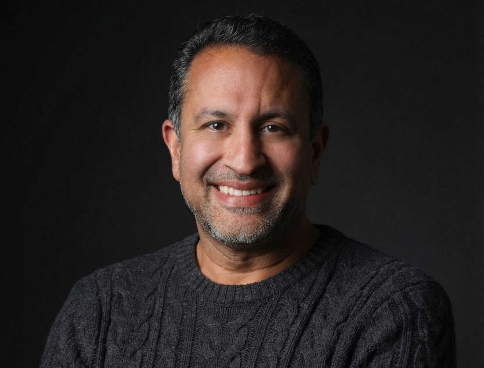 dr shah smiling sweater